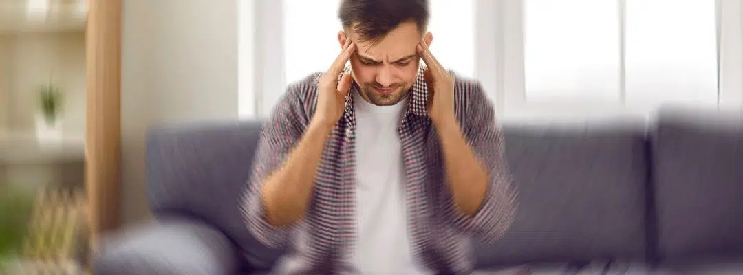 Image of man appearing distraught with hands on head - Symptoms of Gray Death
