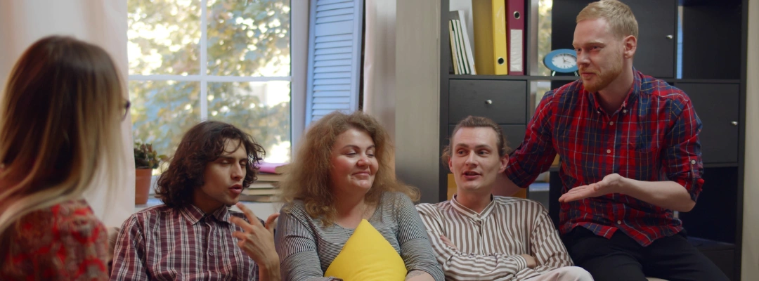 Family members exploring the Twelve Traditions of Families Anonymous during a meeting