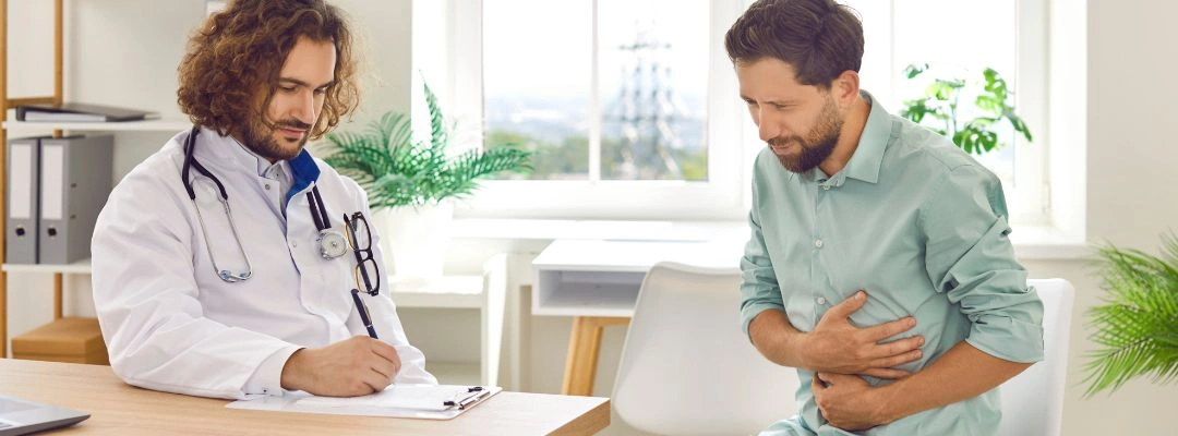 Image of medical professional explaining treatment options for alcohol-related stomach painImage of medical professional explaining treatment options for alcohol-related stomach pain