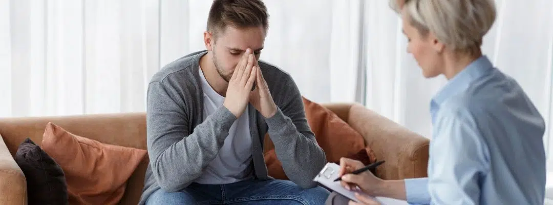 Image of a man in a therapy session, symbolizing the benefits of addiction recovery as a lifelong journey of growth and healing