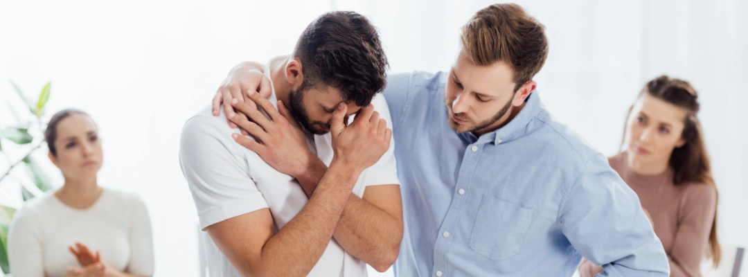 An AA member speaking with a potential sponsor after a meeting, symbolizing trust, openness, and finding the right mentor in recovery