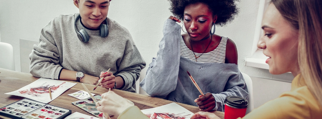 Image of a young male and female getting art instruction from a therapist - Art Therapy for Addiction Recovery Support - Purpose Healing Center