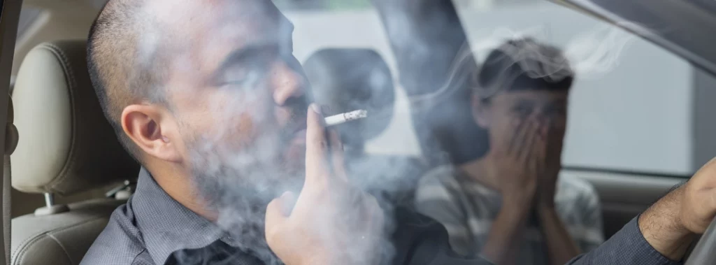 Image of a man smoking weed in a car with others looking on - Can You Fail A Drug Test From Secondhand Smoke - Purpose Healing Center