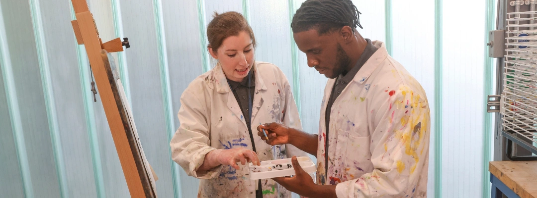 Image of Art therapist guiding a patient through painting during addiction recovery