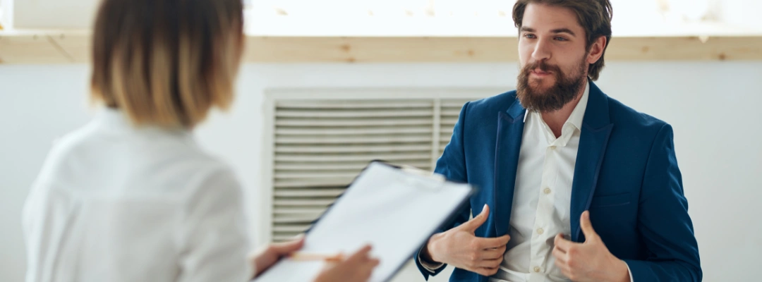 Image of a clinician conducting an alcohol assessment with a patient using structured interview tools and questionnaires
