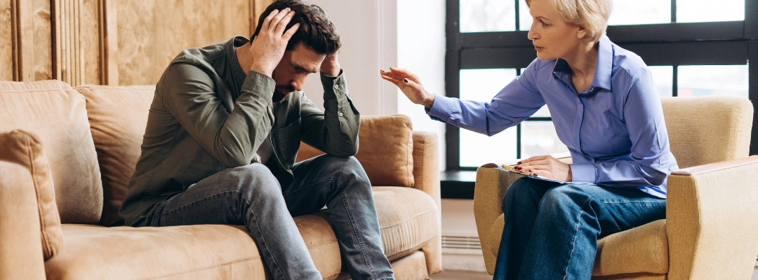 Image of a counselor talking to a client in a calm, supportive environment, providing guidance and emotional support during the recovery process