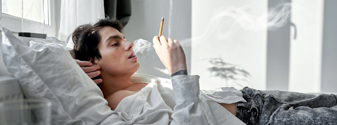 Image of smoke from a cannabis cigarette filling a small, enclosed room