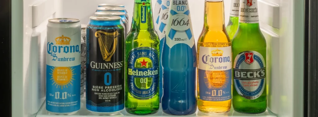 Images of various name-brand non-alcoholic beers on a refrigerator shelf - Is Non Alcoholic Beer Bad for Your Liver - Purpose Healing Center
