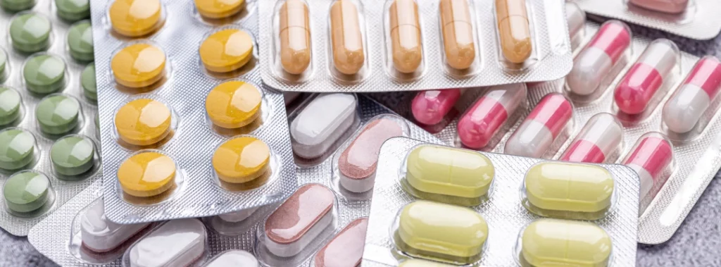 Images of various drug capsules and pills all sealed in protective packaging - What Drugs Are Legal in Arizona - Purpose Healing Center