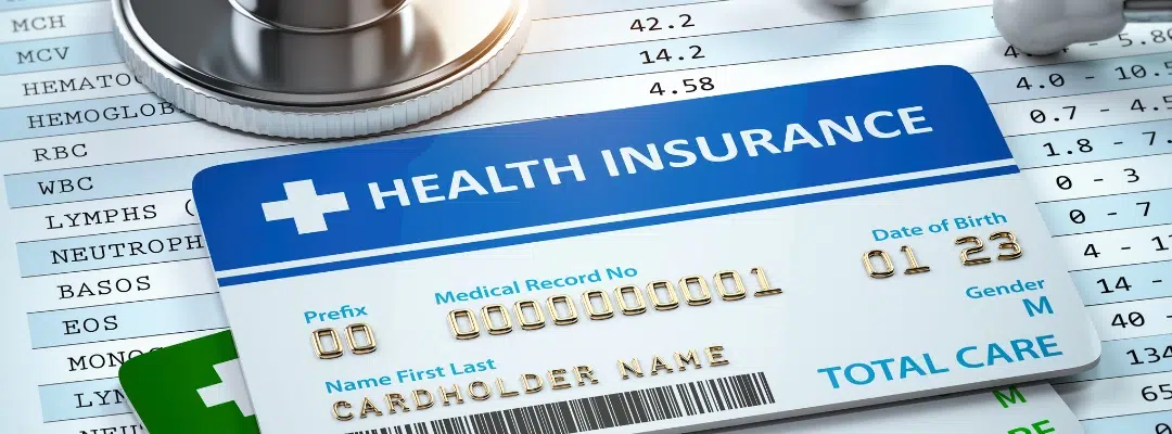 Image of Close-up of a medical insurance card representing coverage for art therapy in addiction treatment