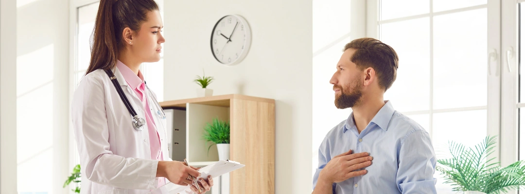 Image of a doctor monitoring a patient’s vital signs during medical detox to manage hypertension and prevent delirium tremens