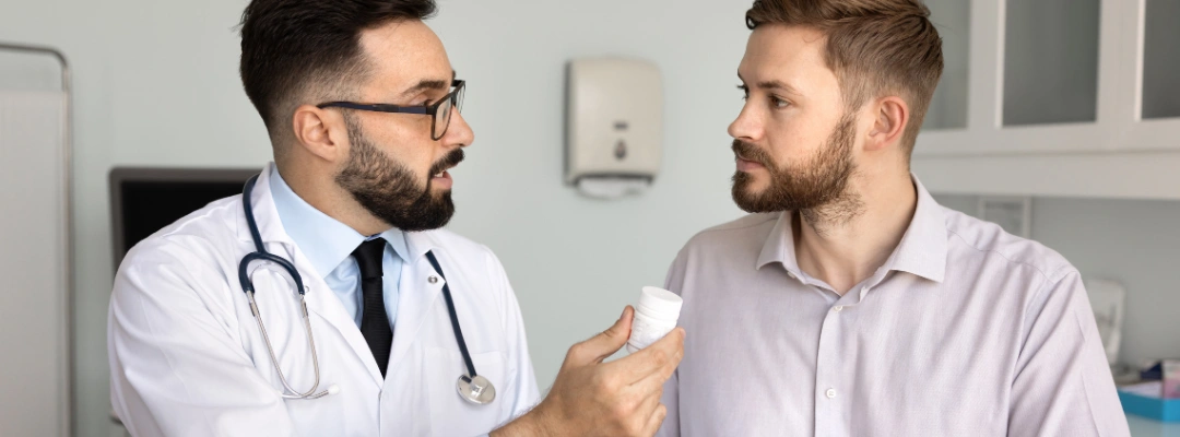 Image of a medical professional administering medication to a patient, illustrating treatment of high blood pressure during alcohol withdrawal