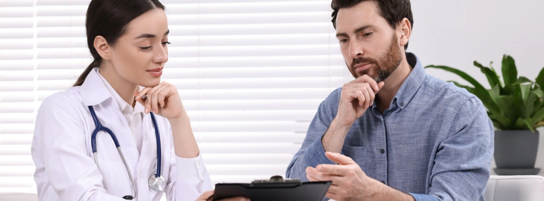 Image of a patient receiving 24-7 medical care at a detox center, with staff monitoring blood pressure during alcohol withdrawal